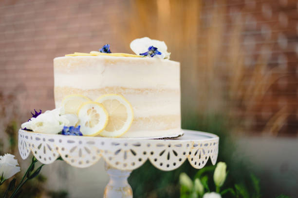 istock Small wedding cake with blue and yellow lemon accents 1304094555