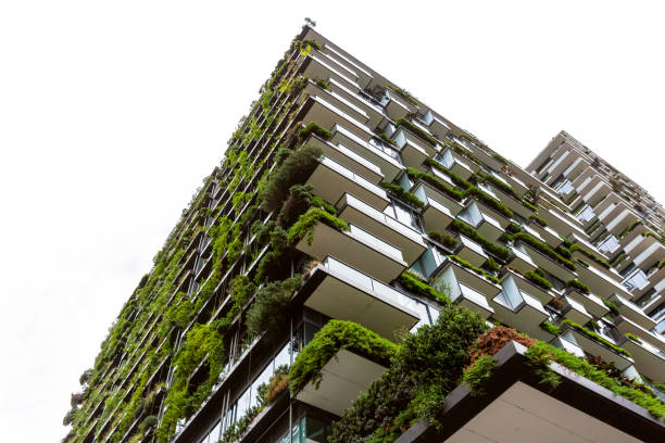 istock Low angle view of appartment building with vertical garden, background with copy space 1304096814