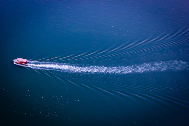 istock Red Boat in Blue Lake 1304097930