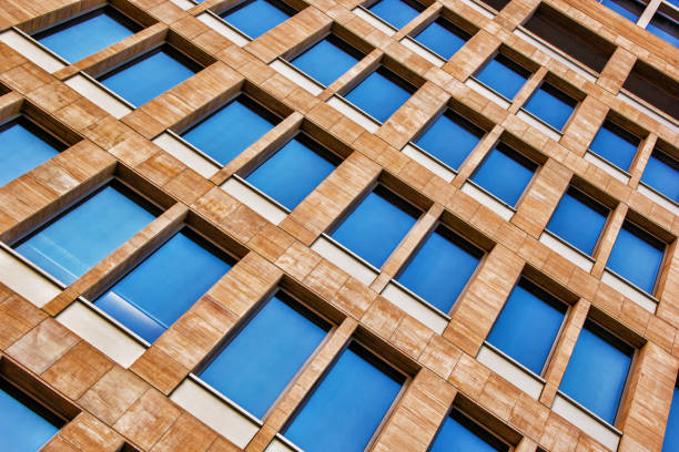 istock Wall pattern of brown stone and wood structure with windows 1304097961