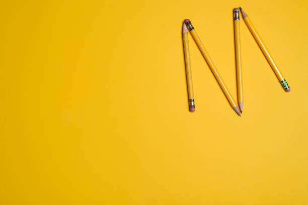 istock Yellow pencils on yellow table 1304099500