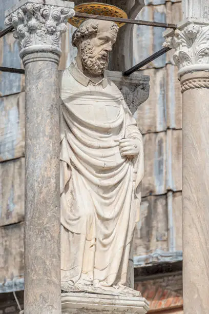 Photo of Decoration elements and a saint priest at roof of Basilica San Marco in Venice, Italy, summer