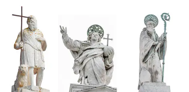 Photo of Set of original most famous ancient top sculptures at church roofs as symbols of Venice isolated at white background, Venice, Italy, closeup, details.