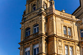 Romantic neo-renaissance stately townhouse, Art Nouveau facade, historical building in old town, most prestigious boulevard Parizska Street at sunny day, Prague, Czech Republic, February 14, 2021