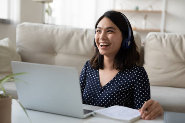 istock Happy millennial mixed race woman enjoying online study. 1304102579