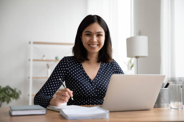 istock Happy asian mixed race student studying distantly on online courses. 1304102625