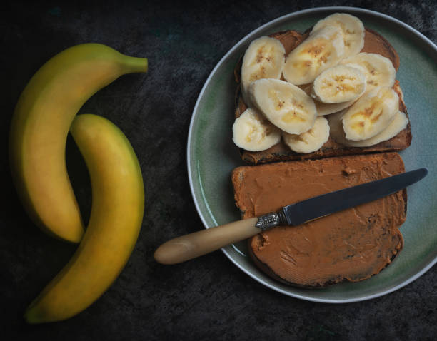istock Home made vagan sandwich wth peanut butter and banana 1304104548