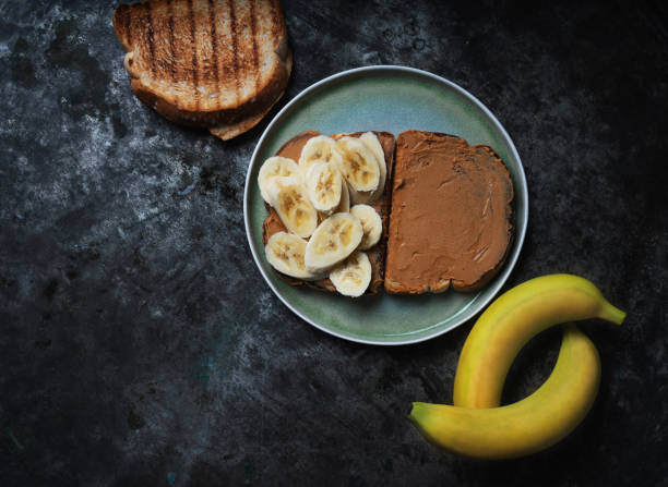 istock Home made vagan sandwich wth peanut butter and banana 1304104559