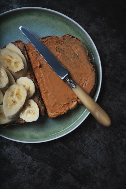 istock Home made vagan sandwich wth peanut butter and banana 1304104565