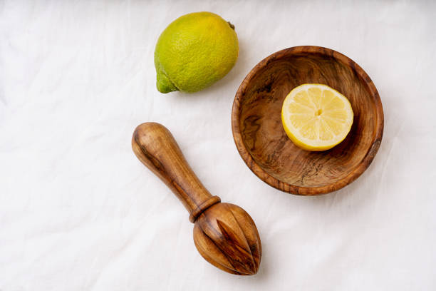 istock Lemons with wooden Juicer 1304106548