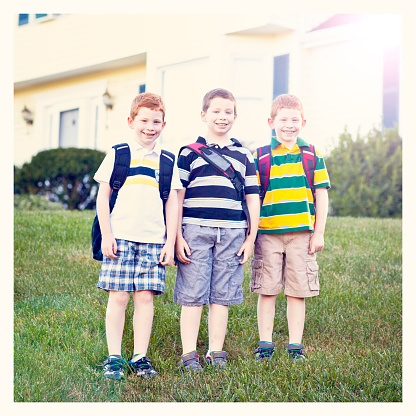 Boys first day of school with backpacks