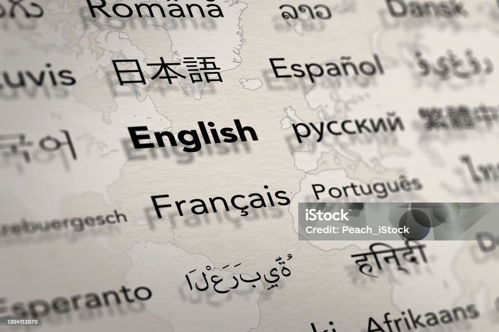 Several important languages on paper with world map background. Several important languages on paper with world map background. Depth of field image. Translate and languages education concept. Translation Stock Photo