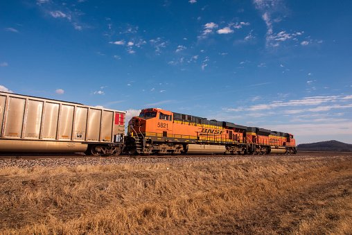 A Burlington Northern Santa Fe Railway Company locamotive stands with attached railway cars south of Clarksville, Missouri, USA, on Feb. 24, 2021.