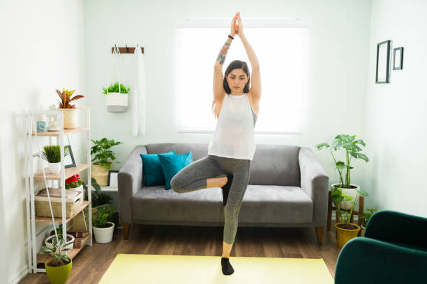 istock Fit pretty woman with a wellness routine practicing yoga 1304114832