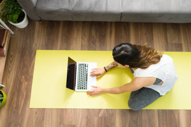 istock Active woman preparing to exercise with an online video 1304114866