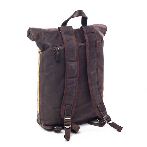 istock Canvas Backpack accessories isolated on white background. Hand made backpack for travelers. 1304114988