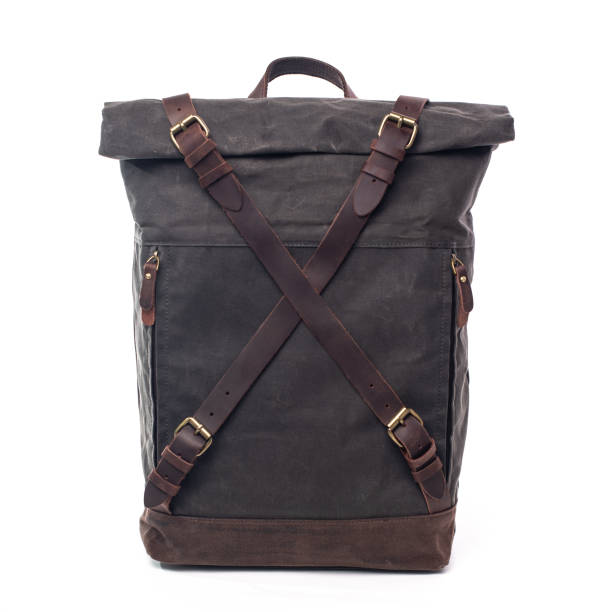 istock Canvas Backpack accessories isolated on white background. Hand made backpack for travelers. 1304114989