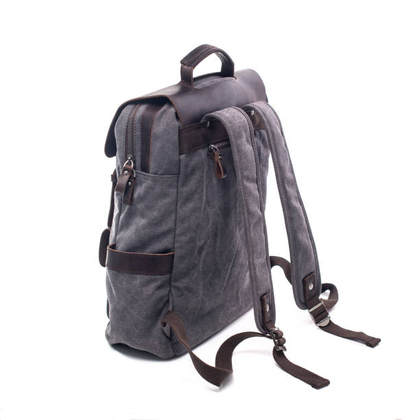 istock Canvas Backpack accessories isolated on white background. Hand made backpack for travelers. 1304114991