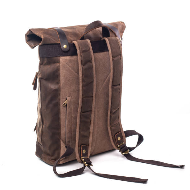 istock Canvas Backpack accessories isolated on white background. Hand made backpack for travelers. 1304114993