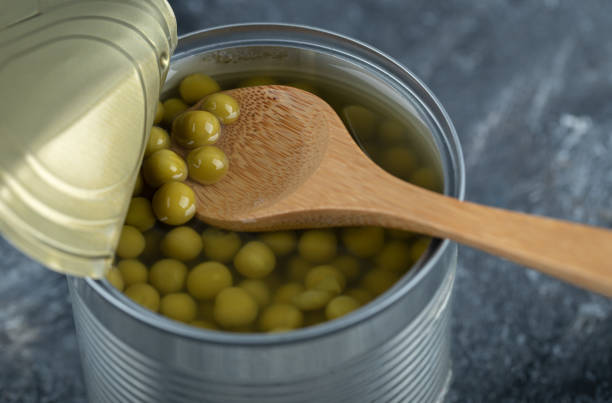 istock Close up photo. Opened tin green olives 1304115680