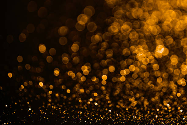 istock Golden sparkles raster festive background. Bokeh lights with bright shiny effect illustration. Overlapping glowing and twinkling spots decorative backdrop. Abstract glittering circles. 1304120123