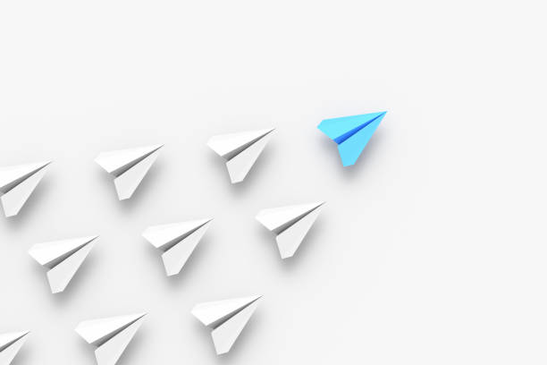 Leadership concept, blue leader plane leading white planes, on white background stock photo