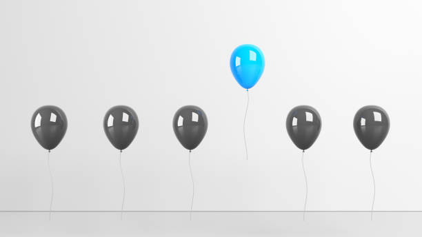Standing out from the crowd and different concept, blue and black balloon on white background