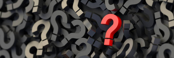 istock Red question mark on a background of black signs, FAQ Concept 1304121047