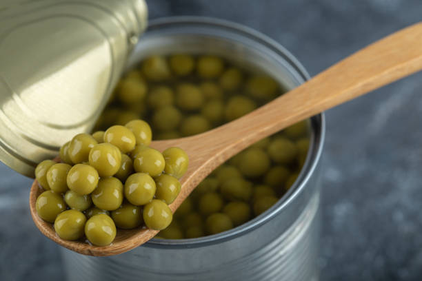 istock Taking olives from jar with wooden spoon 1304122711