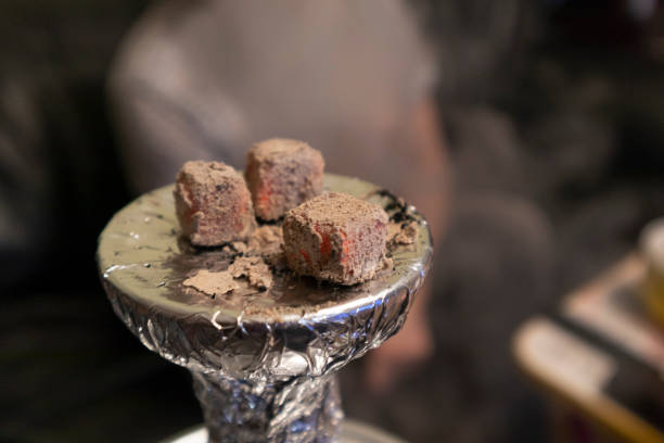 istock smoking hookah at home evening with friends hot coals 1304125323