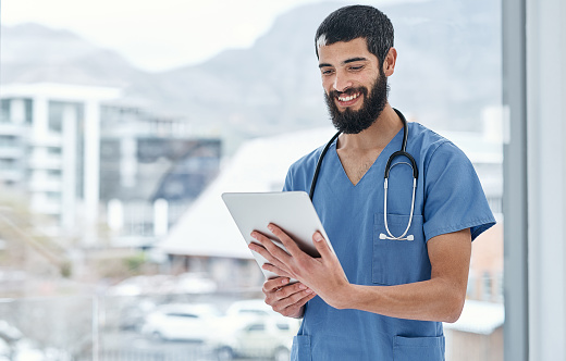 Shot of a medical practitioner using a digital tablet in a hospital