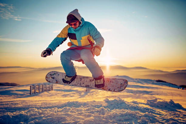 istock Snowboarder having fun at ski resort 1304125530