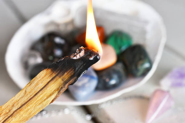 Burning Palo Santo and Healing Crystals stock photo