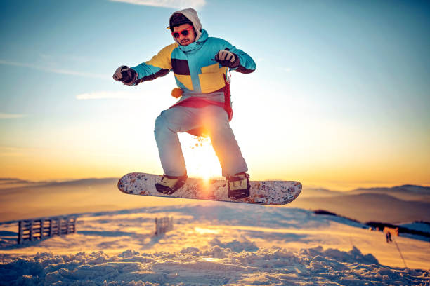 istock Snowboarder having fun at ski resort 1304126863