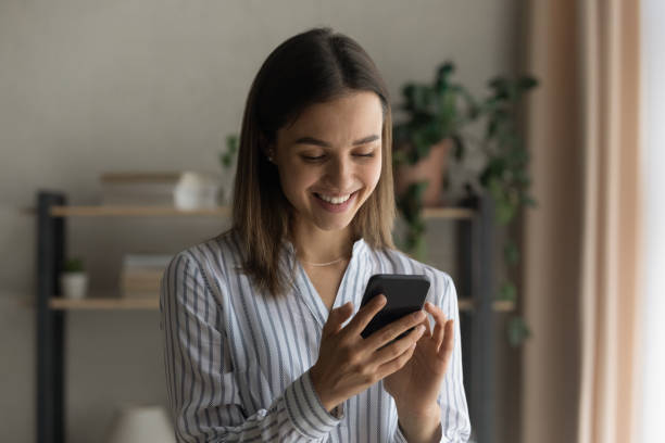 istock Happy young female student teenager using mobile phone app 1304127580