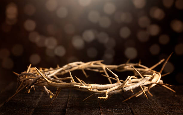istock The Crown of Throns on a Brown Wooden Surface 1304128994