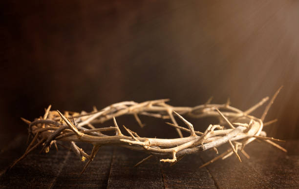 istock The Crown of Throns on a Brown Wooden Surface 1304129023