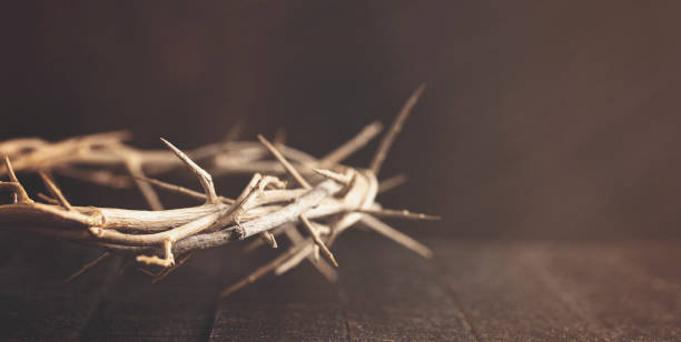 istock The Crown of Throns on a Brown Wooden Surface 1304129056