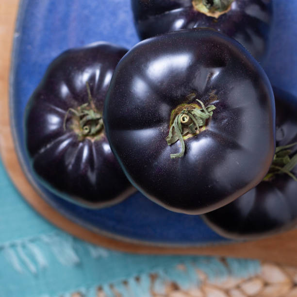 istock Black or dark purple heirloom tomatoes 1304132147