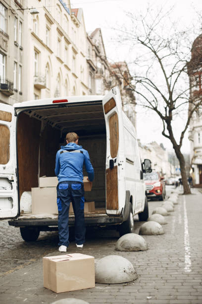 istock Delivery man with package outdoors 1304132989