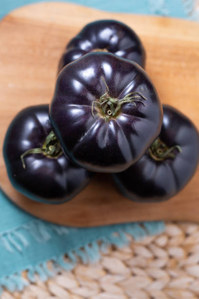 istock Black or dark purple heirloom tomatoes 1304133141