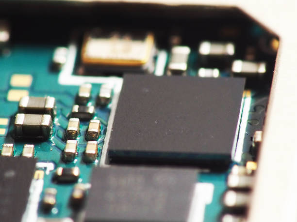 istock Close up shoot of Surface Mount Device (SMD) parts such as IC, micro chips, processors, led, resistor, capacitor, camera module, etc. soldered on Printed Circuit Board (PCB) 1304133999