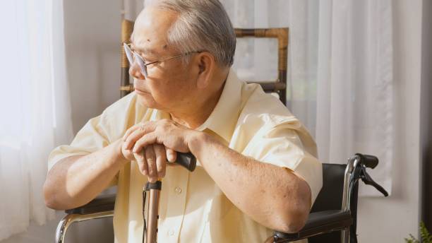 istock Pensive disabled elderly patient sit on wheelchair alone 1304141542
