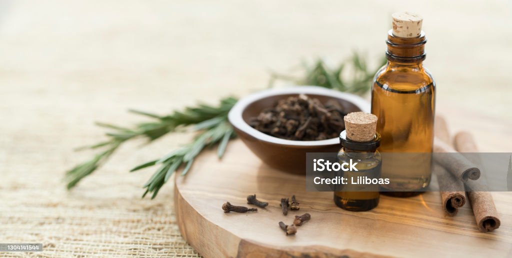 Essential Oils with Rosemary, Cloves & Cinnamon. Essential Oil Stock Photo