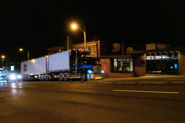 istock Illuminated Semi-Truck driving on the night town 1304143163
