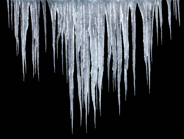 istock roup of icicles isolated on black background 1304143431