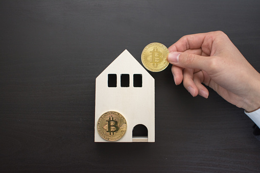 A young man buys a new home with the money he earns from Bitcoin.