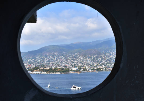 istock View of the Acapulco bay from a circular window 1304145342