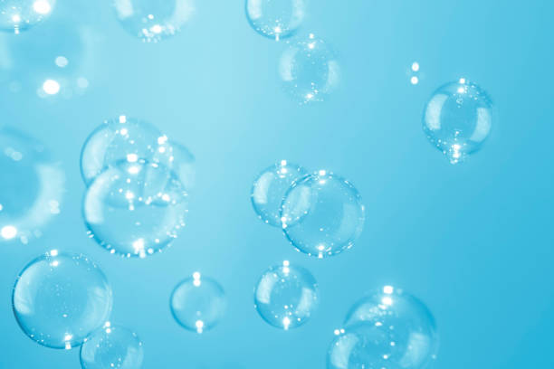 istock Beautiful shiny transparent blue soap bubbles background. 1304150926