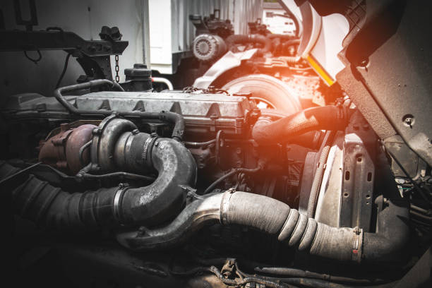 istock Truck tractor engine opened for maintenance servicing. Diesel truck engine. 1304150946